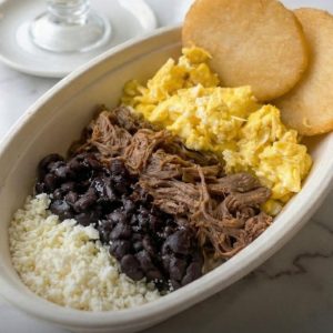 Arepa, shredded chicken and eggs